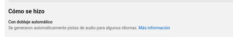 Etiqueta Con doblaje automático en la sección Cómo se hizo de la descripción de un video de YouTube
